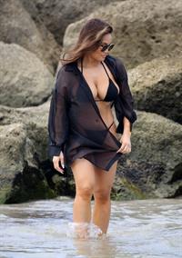 Daphne Joy sexy ass and boobs in a thong bikini at the beach seen by paparazzi showing nice cleavage and booty.
