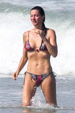 Gisele Bundchen sexy ass in a thong bikini at the beach seen by paparazzi with Tom Brady.

