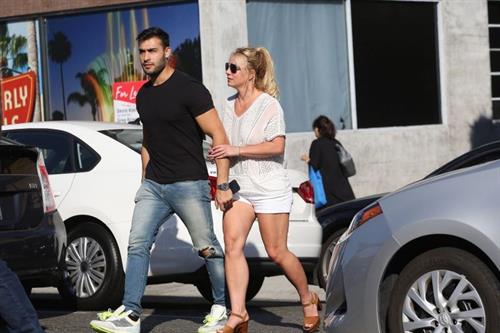 Britney Spears Pictures Britney Spears braless boobs in a see through blouse showing her nipples seen by paparazzi.