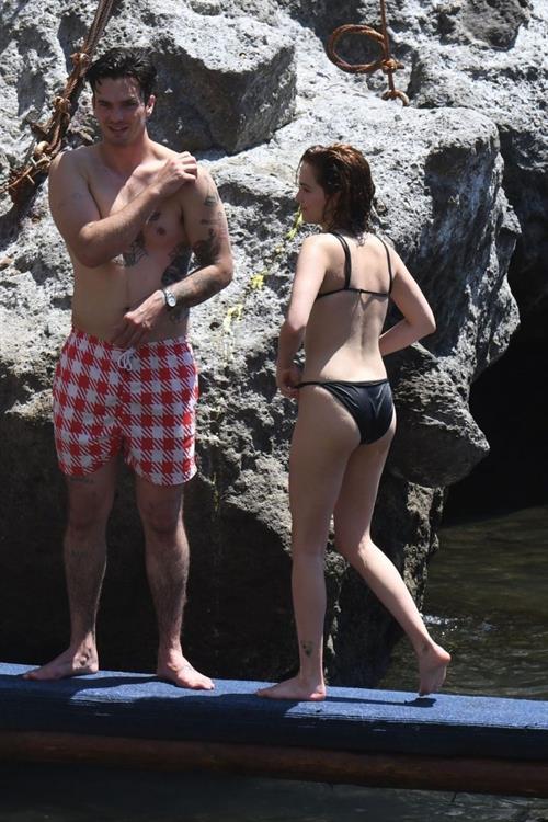 Zoey Deutch sexy boobs and ass in a little bikini in the water seen by paparazzi.



















