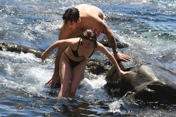 Zoey Deutch sexy boobs and ass in a little bikini in the water seen by paparazzi.



















