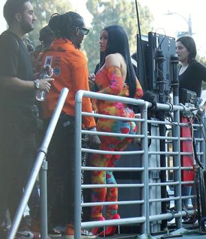 Cardi B boobs and booty on display on and off stage showing nice cleavage and her sexy ass in a tight dress.























