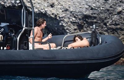 Madalina Diana Ghenea sexy ass and cleavage in a thong bikini seen by paparazzi.


