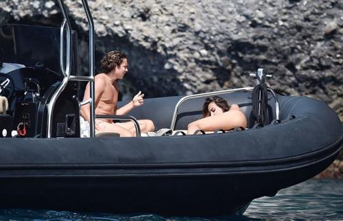 Mădălina Diana Ghenea Bikini Pictures Madalina Diana Ghenea sexy ass and cleavage in a thong bikini seen by paparazzi.