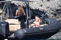 Madalina Diana Ghenea sexy ass and cleavage in a thong bikini seen by paparazzi.


