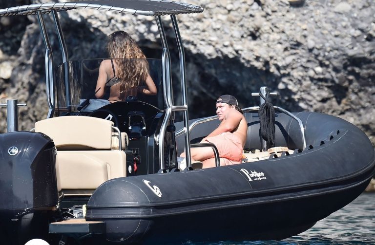 Mădălina Diana Ghenea Bikini Pictures Madalina Diana Ghenea sexy ass and cleavage in a thong bikini seen by paparazzi.