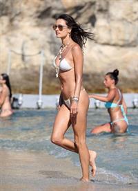 Alessandra Ambrosio ass and cleavage in a sexy thong bikini at the beach seen by paparazzi.





