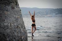 Kimberley Garner at the beach with her dog