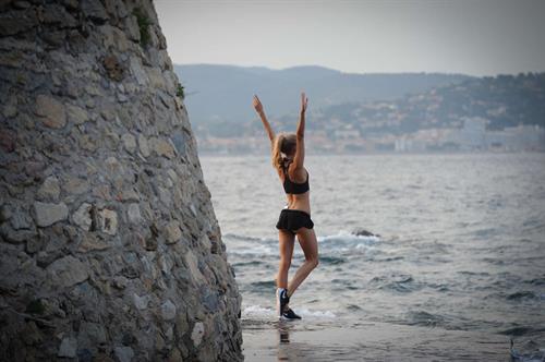 Kimberley Garner at the beach with her dog