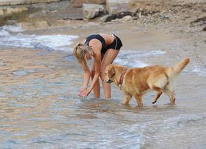 Kimberley Garner at the beach with her dog