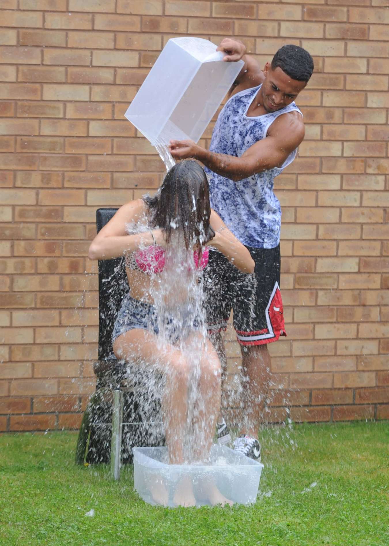 Chloe Goodman gets water dumped on her