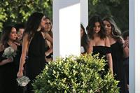 Selena Gomez sexy in a black dress for her cousins wedding showing nice cleavage seen by paparazzi.























