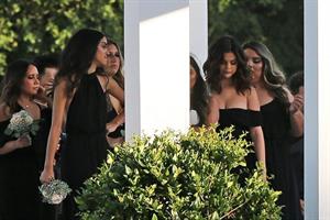 Selena Gomez sexy in a black dress for her cousins wedding showing nice cleavage seen by paparazzi.























