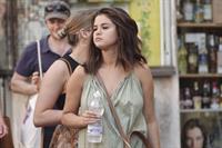 Selena Gomez braless and sexy in a dress seen by paparazzi in Rome.


