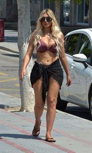 Chloe Ferry big boobs showing nice cleavage seen by paparazzi in a sexy bikini.








