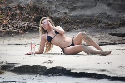 Trista Mikail sexy thong bikini photo shoot showing nice cleavage and ass on the beach.












