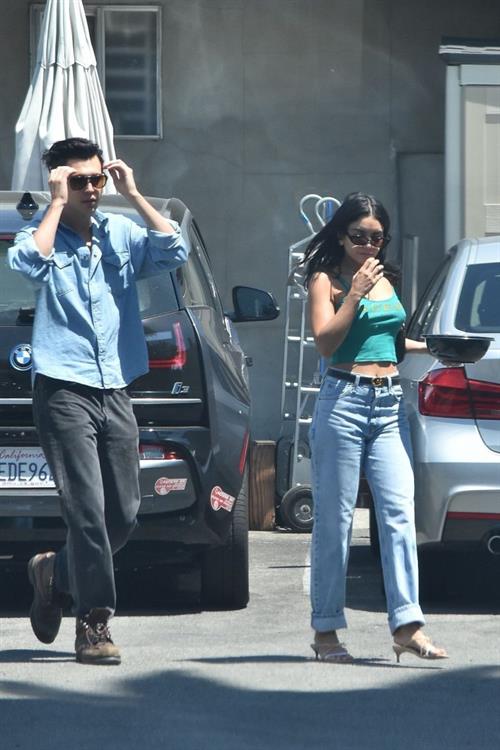 Vanessa Hudgens Pictures Vanessa Hudgens braless nipples pokies in a green top showing off her tits seen by paparazzi with Austin Butler.
