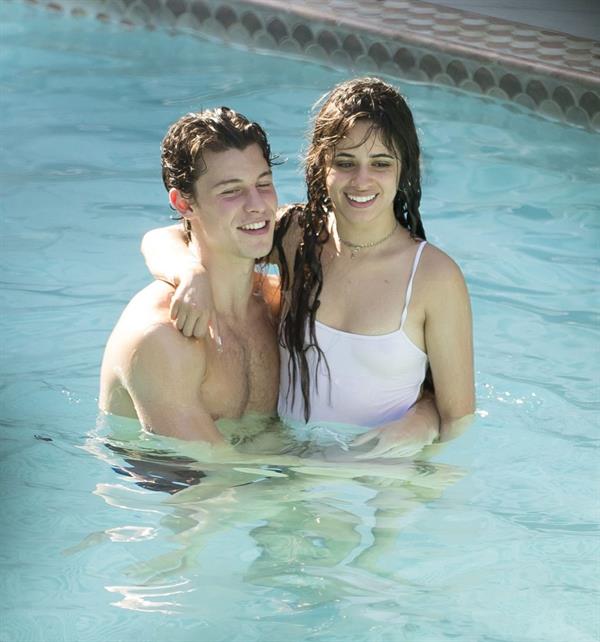 Camila Cabello and Shawn Mendes making out in the water seen kissing by paparazzi.





































