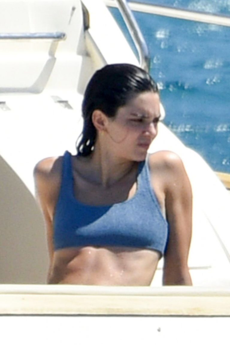 Kendall Jenner Bikini Pictures Kendall Jenner in a sexy bikini swimsuit on a yacht with Kourtney Kardashian seen by paparazzi.