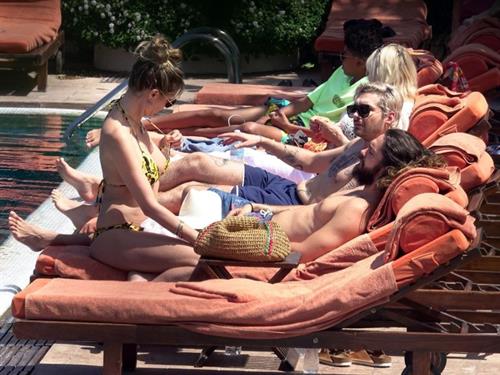 Heidi Klum Bikini Pictures Heidi Klum nip slip in a sexy bikini seen by paparazzi and kissing her husband and flashing her boob.