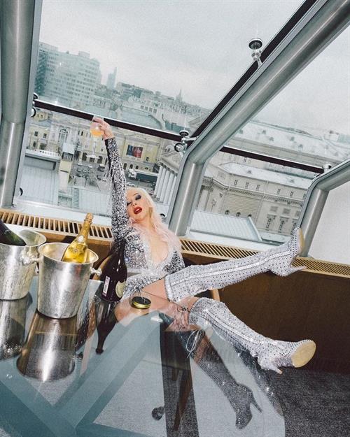 Christina Aguilera showing some nice cleavage with her big tits in a low cut outfit.












