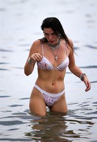 Bella Thorne areola peek in a sexy bikini at the beach seen by paparazzi.




