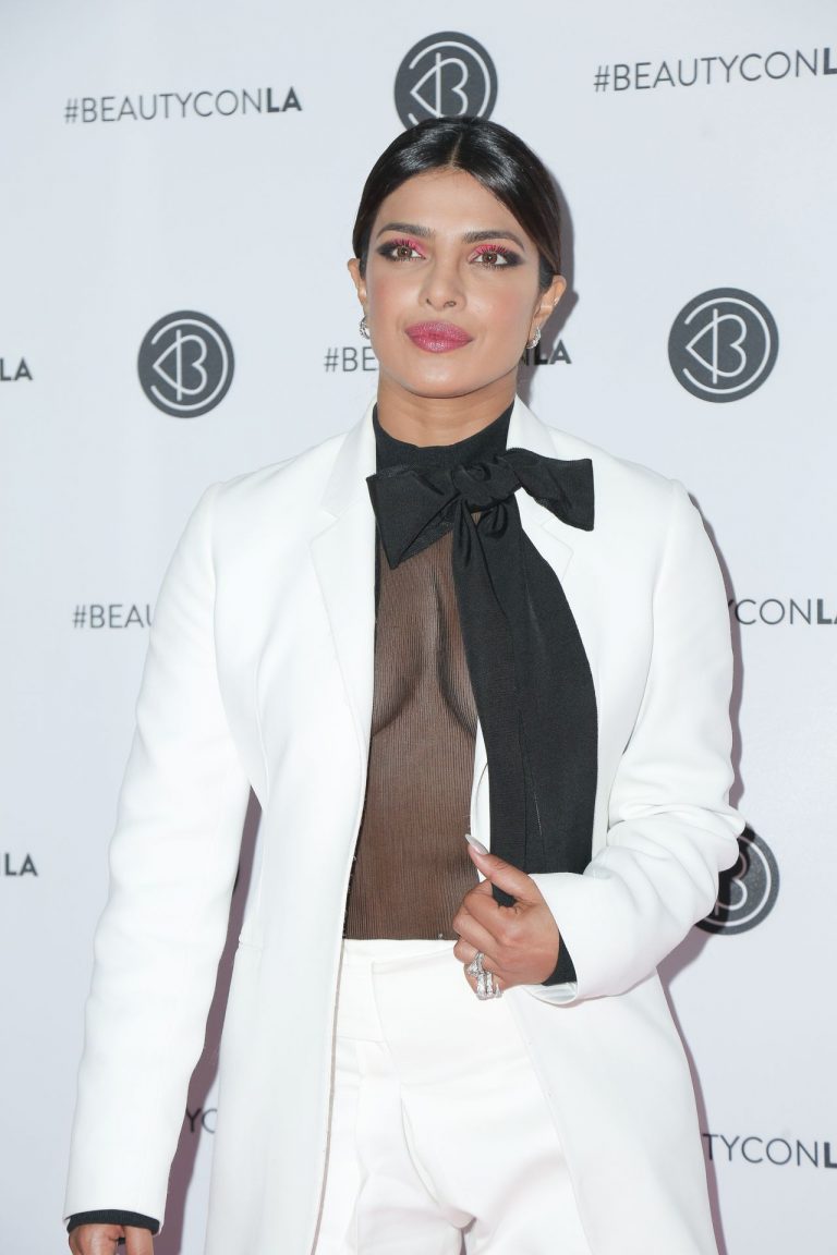 Priyanka Chopra Pictures Priyanka Chopra braless boobs in a see through top showing some nice cleavage at Beautycon.