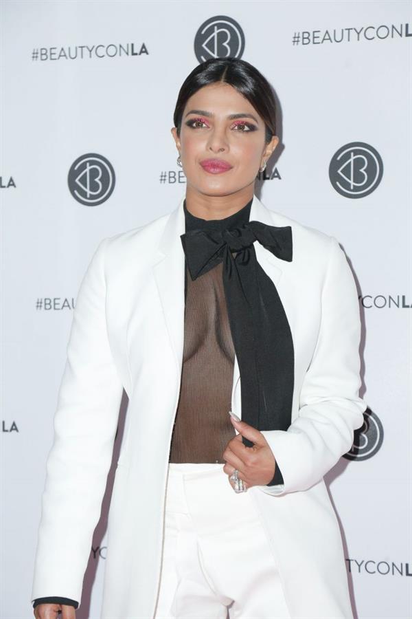 Priyanka Chopra braless boobs in a see through top showing some nice cleavage at Beautycon.

