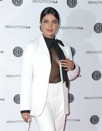 Priyanka Chopra braless boobs in a see through top showing some nice cleavage at Beautycon.

