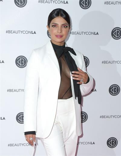 Priyanka Chopra braless boobs in a see through top showing some nice cleavage at Beautycon.

