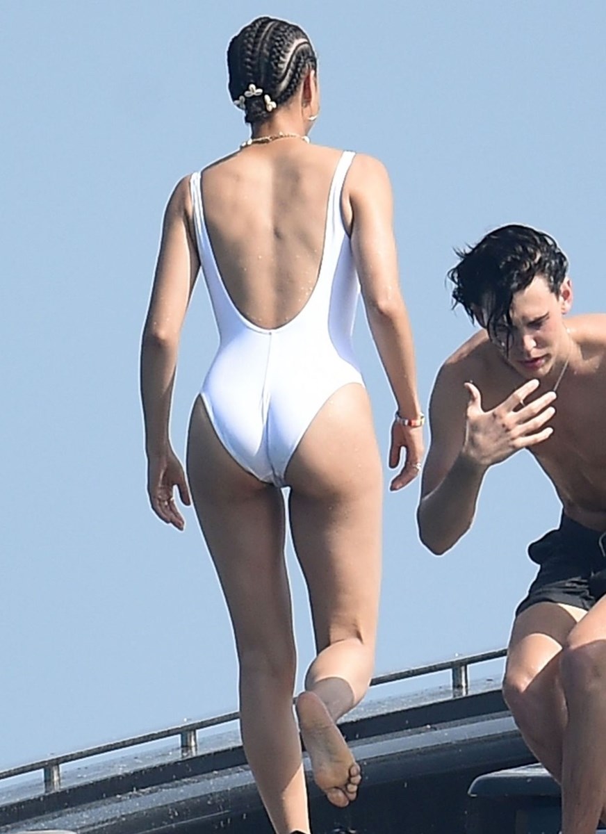 Nathalie Emmanuel Pictures Nathalie Emmanuel sexy ass in a white swimsuit seen by paparazzi.