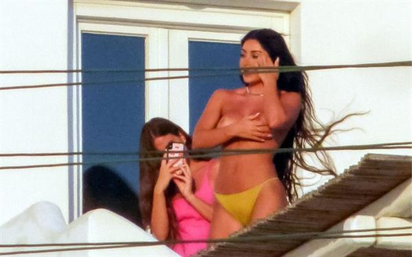 Martha Kalifatidis caught topless by paparazzi with her hand covering her nude big boobs.





