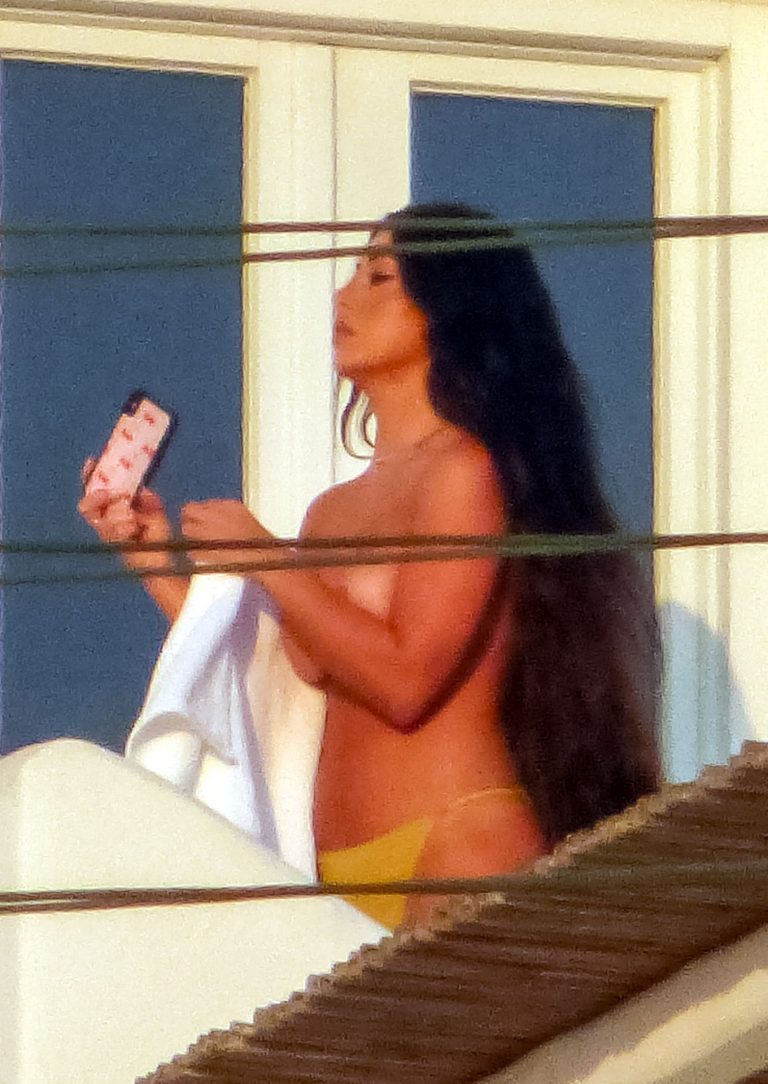 Martha Kalifatidis Pictures Martha Kalifatidis caught topless by paparazzi with her hand covering her nude big boobs.