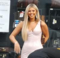 Belle Hassan wardrobe malfunction as the ass of her dress rips she had to call someone to sew it seen by paparazzi.




