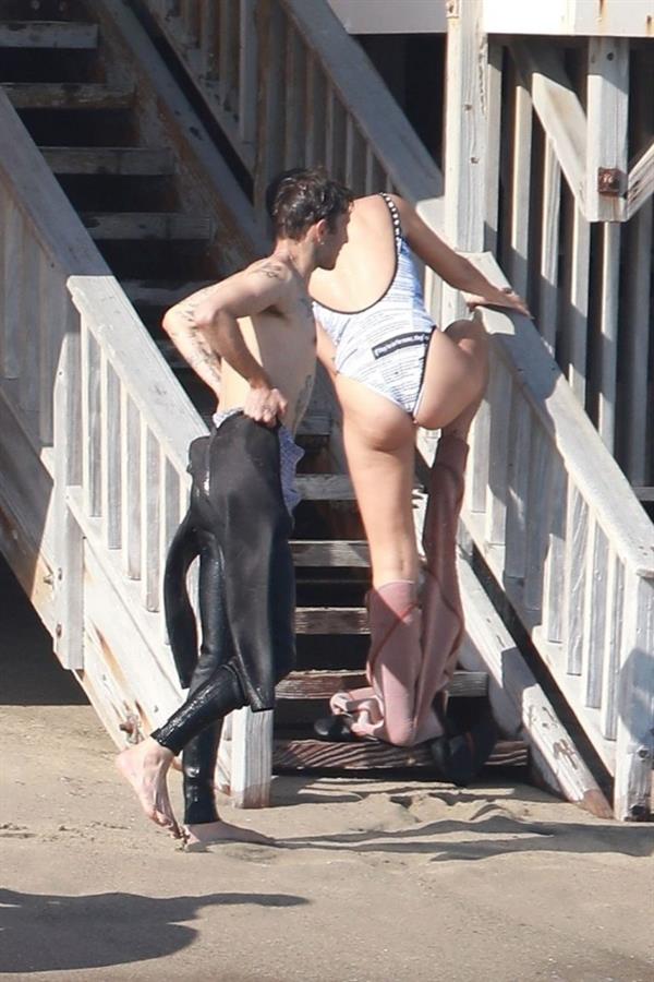 Dua Lipa sexy ass and cleavage in a swimsuit at the beach seen with her boyfriend by paparazzi.













