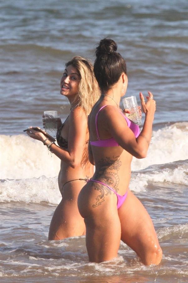 Aline Riscado seen at the beach by paparazzi in a sexy ass thong bikini showing nice cleavage.


