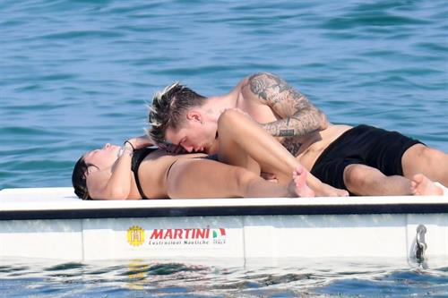 Bella Thorne Bikini Pictures Bella Thorne making out and having fun with her boyfriend in a sexy little bikini seen by paparazzi.