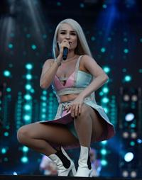 Kim Petras upskirt on stage singing and showing her panties.







