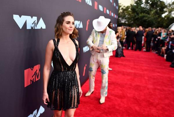 Alison Brie braless boobs showing nice cleavage in a revealing dress on the red carpet at the MTV VMA's.