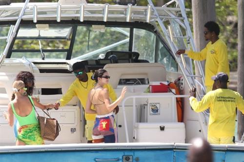 Hailey Bieber, Kendall Jenner and Justine Skye sexy bikini and swimsuit photos seen on a boat drinking for Hailey Bieber's bachelorette party.
