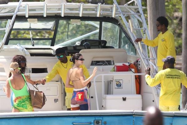 Hailey Bieber, Kendall Jenner and Justine Skye sexy bikini and swimsuit photos seen on a boat drinking for Hailey Bieber's bachelorette party.
