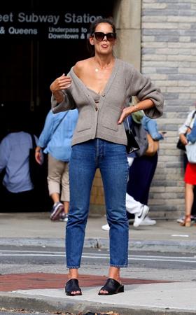 Katie Holmes sexy cleavage seen by paparazzi in a revealing outfit.

