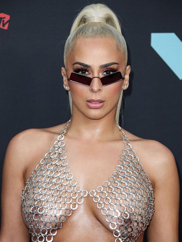 Veronica Vega showing off her braless boobs on the red carpet at the MTV VMA's in a see through top.














