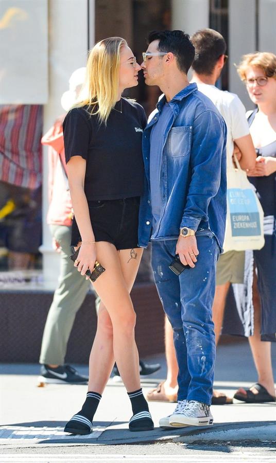 Sophie Turner braless boobs kissing Joe Jonas seen by paparazzi.
















