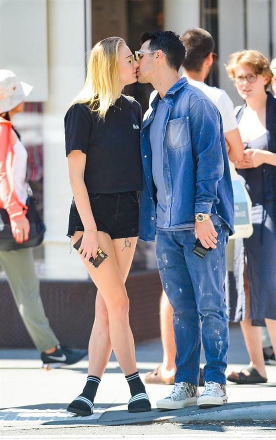 Sophie Turner braless boobs kissing Joe Jonas seen by paparazzi.
















