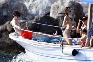 Lily-Rose Depp sexy ass in a little thong bikini making out with Timothee Chalamet on a boat seen by paparazzi.





