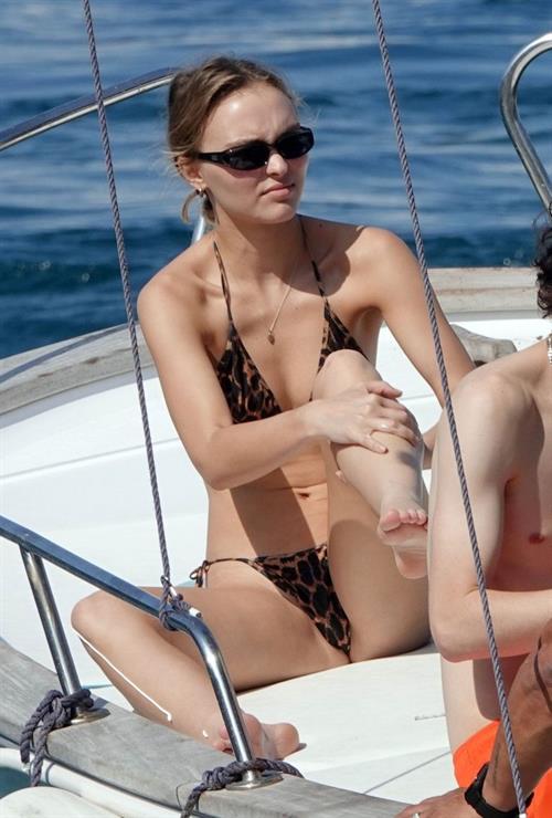 Lily-Rose Depp Bikini Pictures Lily-Rose Depp sexy ass in a little thong bikini making out with Timothee Chalamet on a boat seen by paparazzi.