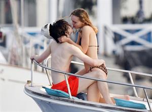 Lily-Rose Depp sexy ass in a little thong bikini making out with Timothee Chalamet on a boat seen by paparazzi.






