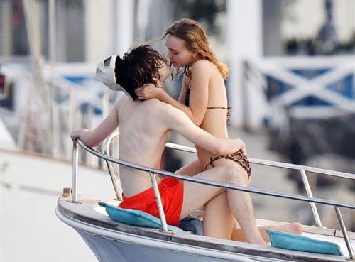 Lily-Rose Depp sexy ass in a little thong bikini making out with Timothee Chalamet on a boat seen by paparazzi.





