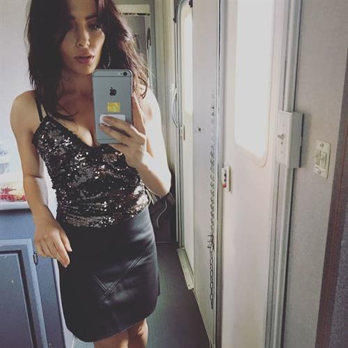 Sarah Shahi taking a selfie